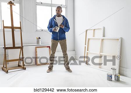 Black artist standing in studio View Large Photo Image Stock Image - Black artist standing in studio. Fotosearch