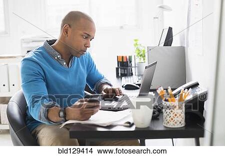 Black businessman working in office View Large Photo Image Picture - Black businessman working in office. Fotosearch