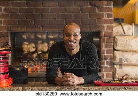 Black server working in restaurant View Large Photo Image Stock Image - Black server working in restaurant. Fotosearch