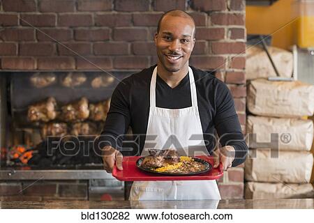 Black server working in restaurant View Large Photo Image Stock Image - Black server working in restaurant. Fotosearch