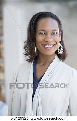 Black woman smiling outdoors View Large Photo Image Stock Photography - Black woman smiling outdoors. Fotosearch