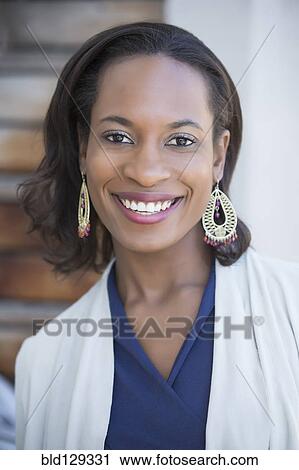 Stock Image - Black woman smiling. Fotosearch