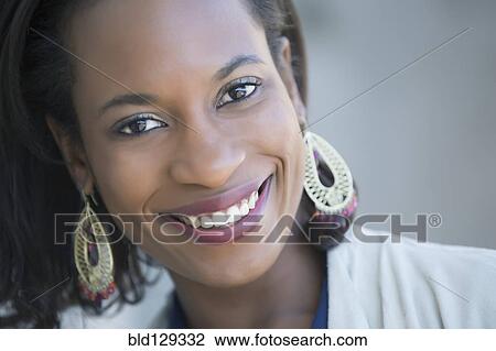 Stock Image - Black woman smiling. Fotosearch