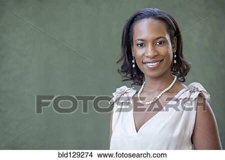 Picture - Black woman wearing white gown. Fotosearch