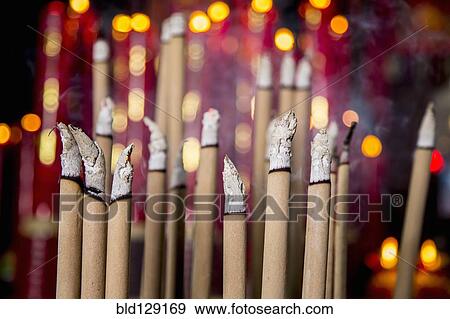 Burning incense in Buddhist temple View Large Photo Image Stock Photo - Burning incense in Buddhist temple. Fotosearch