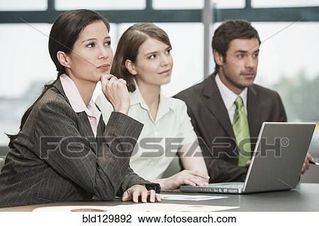 Business people listening in meeting View Large Photo Image Stock Image - Business people listening in meeting. Fotosearch
