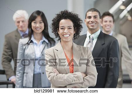 Business people smiling in office View Large Photo Image Stock Image - Business people smiling in office. Fotosearch
