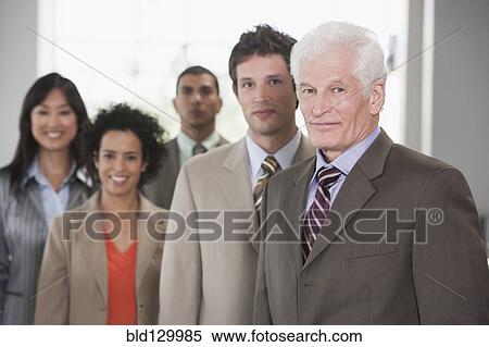 Business people smiling in office View Large Photo Image Stock Photography - Business people smiling in office. Fotosearch