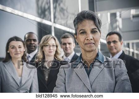 Business people smiling outdoors View Large Photo Image Stock Photography - Business people smiling outdoors. Fotosearch