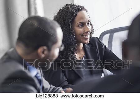 Business people talking in meeting View Large Photo Image Stock Image - Business people talking in meeting. Fotosearch