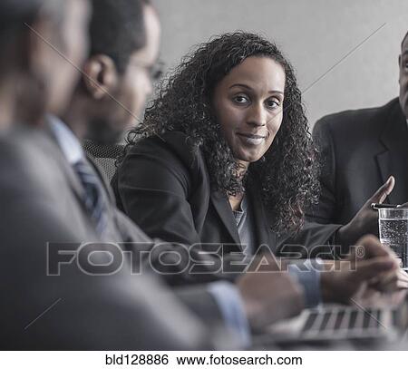 Stock Photograph - Business people talking in meeting. Fotosearch