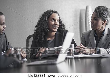 Business people using digital tablet in meeting View Large Photo Image Stock Image - Business people using digital tablet in meeting. Fotosearch