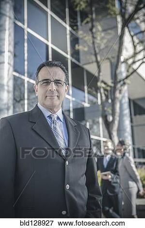 Stock Photo - Businessman smiling outdoors. Fotosearch