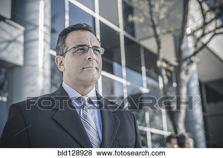 Businessman smiling outdoors View Large Photo Image Stock Photo - Businessman smiling outdoors. Fotosearch