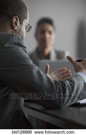 Businessman talking in meeting View Large Photo Image Stock Photograph - Businessman talking in meeting. Fotosearch