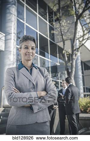 Stock Photograph - Businesswoman smiling outdoors. Fotosearch