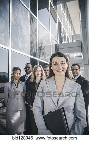 Businesswoman smiling outdoors View Large Photo Image Stock Photograph - Businesswoman smiling outdoors. Fotosearch