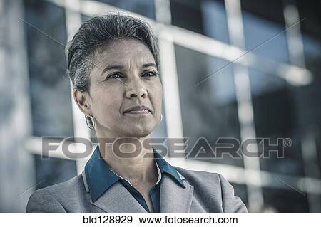 Stock Photo - Businesswoman standing outdoors. Fotosearch