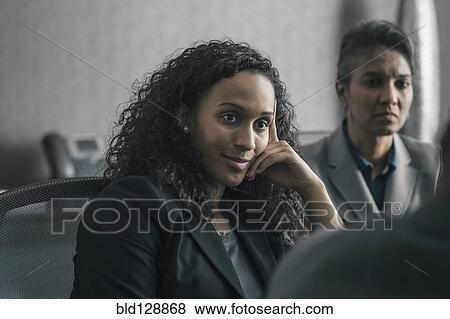 Stock Photo - Businesswomen sitting in meeting. Fotosearch