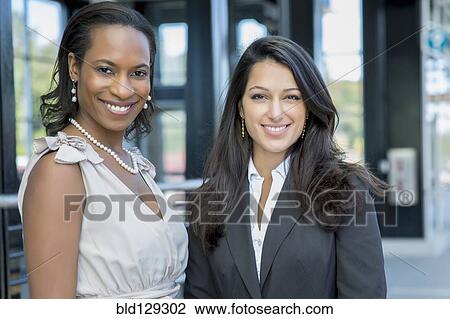 Businesswomen smiling outdoors View Large Photo Image Stock Image - Businesswomen smiling outdoors. Fotosearch