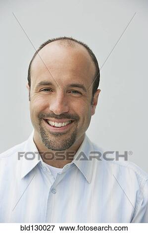 Stock Photo - Caucasian businessman smiling. Fotosearch