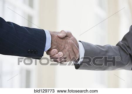 Caucasian businessmen shaking hands View Large Photo Image Stock Image - Caucasian businessmen shaking hands. Fotosearch