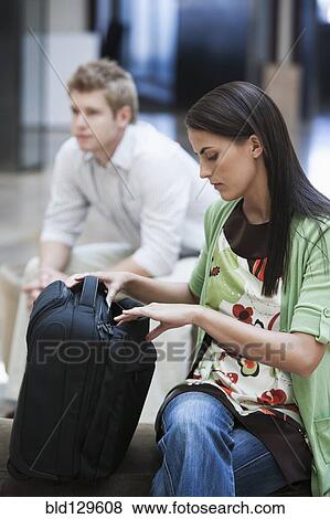 Caucasian businesswoman looking inside briefcase View Large Photo Image Stock Photo - Caucasian businesswoman looking inside briefcase. Fotosearch