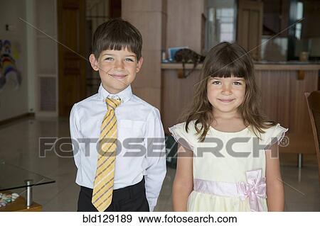 Caucasian children smiling in formal wear View Large Photo Image Stock Photo - Caucasian children smiling in formal wear. Fotosearch