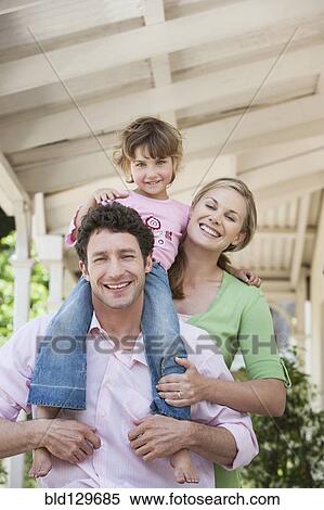 Caucasian family smiling on porch View Large Photo Image Stock Photography - Caucasian family smiling on porch. Fotosearch
