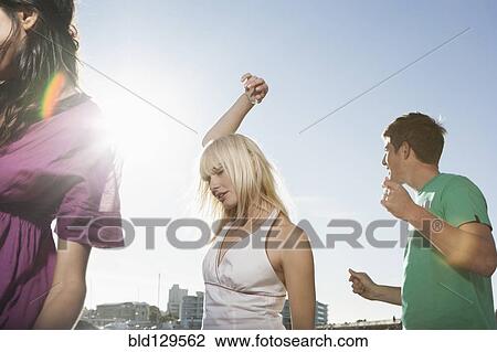 Caucasian friends dancing outdoors View Large Photo Image Stock Image - Caucasian friends dancing outdoors. Fotosearch