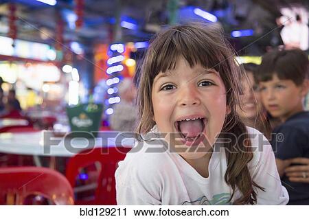 Stock Image - Caucasian girl laughing. Fotosearch
