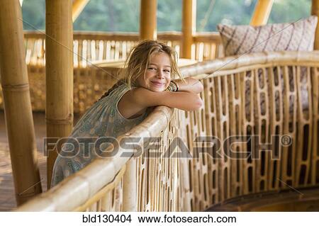 Caucasian girl leaning over railing View Large Photo Image Picture - Caucasian girl leaning over railing. Fotosearch