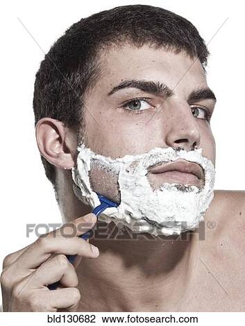 Caucasian man shaving his beard View Large Photo Image Stock Image - Caucasian man shaving his beard. Fotosearch