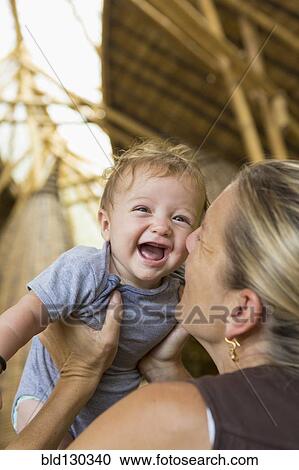 Caucasian mother playing with baby boy View Large Photo Image Stock Image - Caucasian mother playing with baby boy. Fotosearch
