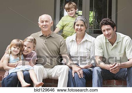 Caucasian multi-generation family smiling on porch View Large Photo Image Stock Photograph - Caucasian multi-generation family smiling on porch. Fotosearch