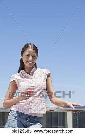 Caucasian woman drinking cocktail outdoors View Large Photo Image Stock Photography - Caucasian woman drinking cocktail outdoors. Fotosearch