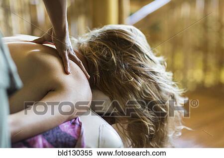 Stock Photography - Caucasian woman having massage. Fotosearch