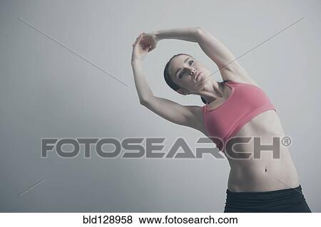 Caucasian woman stretching arms View Large Photo Image Stock Photo - Caucasian woman stretching arms. Fotosearch