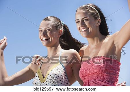 Caucasian women cheering outdoors View Large Photo Image Stock Photo - Caucasian women cheering outdoors. Fotosearch