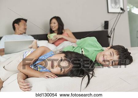 Children playing in parents' bed View Large Photo Image Picture - Children playing in parents' bed. Fotosearch