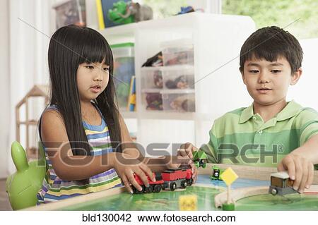 Children playing with train set View Large Photo Image Stock Image - Children playing with train set. Fotosearch