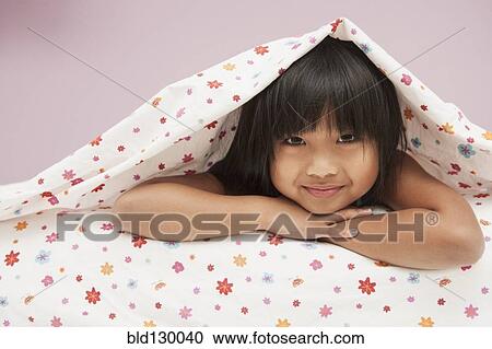 Chinese girl laying under covers View Large Photo Image Stock Image - Chinese girl laying under covers. Fotosearch