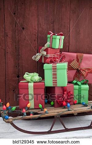 Christmas gifts and lights on sled View Large Photo Image Stock Photography - Christmas gifts and lights on sled. Fotosearch