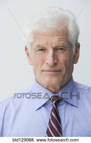 Stock Photo - Close up of Caucasian businessman's serious face. Fotosearch