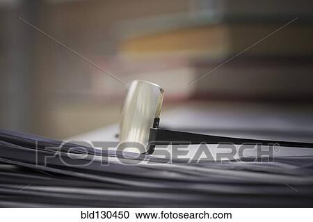 Close up of glasses on stack of papers View Large Photo Image Stock Image - Close up of glasses on stack of papers. Fotosearch