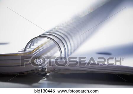 Stock Photography - Close up of spiral notebook spine. Fotosearch