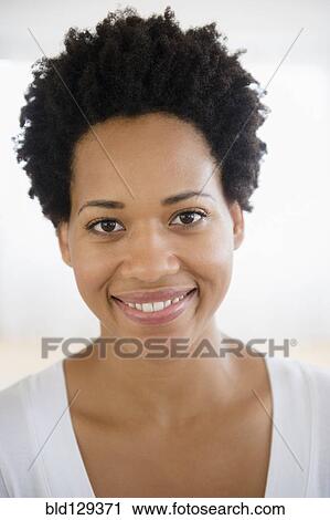 Close up portrait of smiling Black woman View Large Photo Image Stock Image - Close up portrait of smiling Black woman. Fotosearch