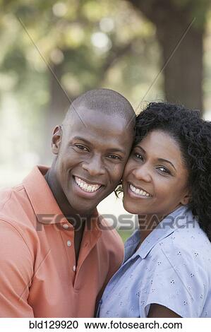 Couple hugging in park View Large Photo Image Stock Image - Couple hugging in park. Fotosearch