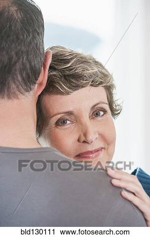 Couple hugging outdoors View Large Photo Image Stock Image - Couple hugging outdoors. Fotosearch