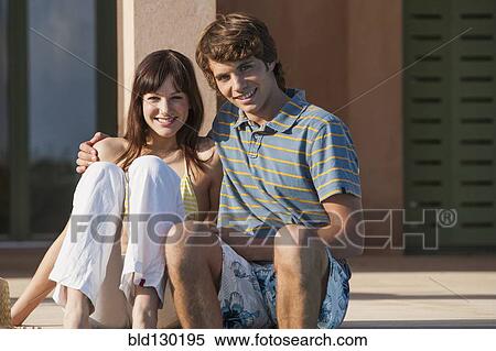 Stock Photography - Couple hugging outdoors. Fotosearch